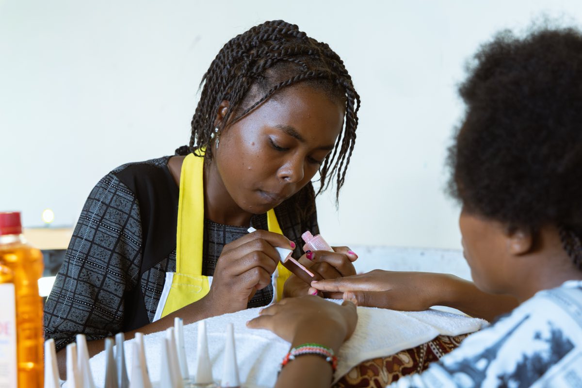 Beauty therapy trainees practising treatments