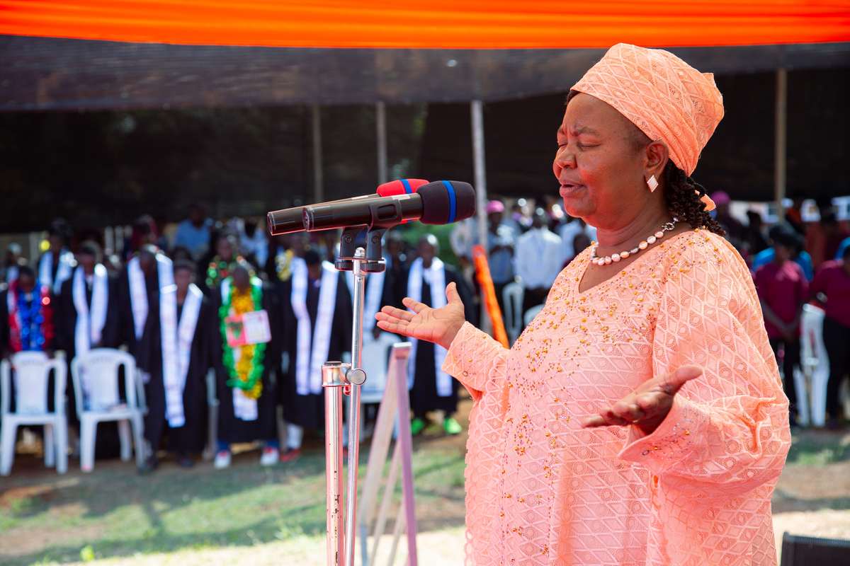 Mummy Esther Mully praying a blessing over the graduating class